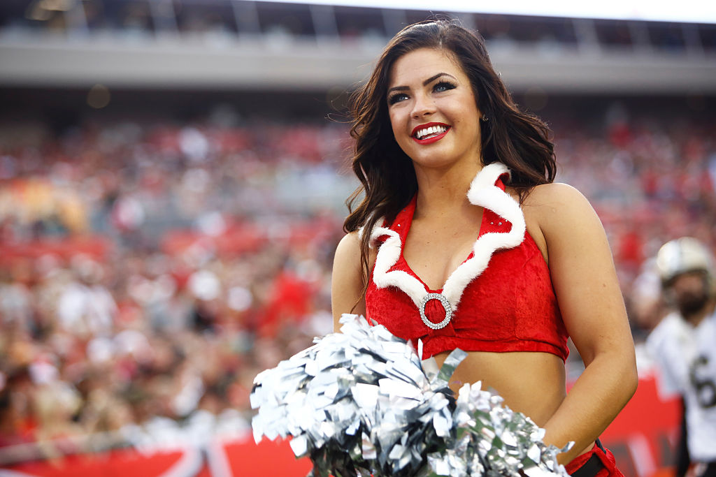 A Tampa Bay Buccaneers cheerleader performs for the crowd during the second quarter of an NFL game