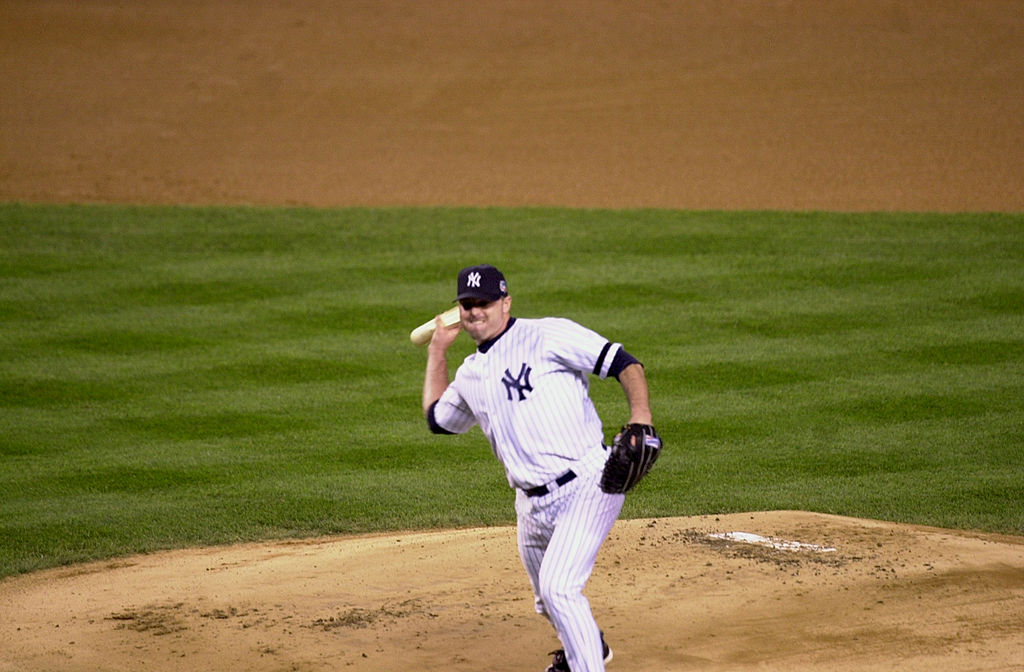 Yankee pitcher Roger Clemens throws a piece of broken bat ba