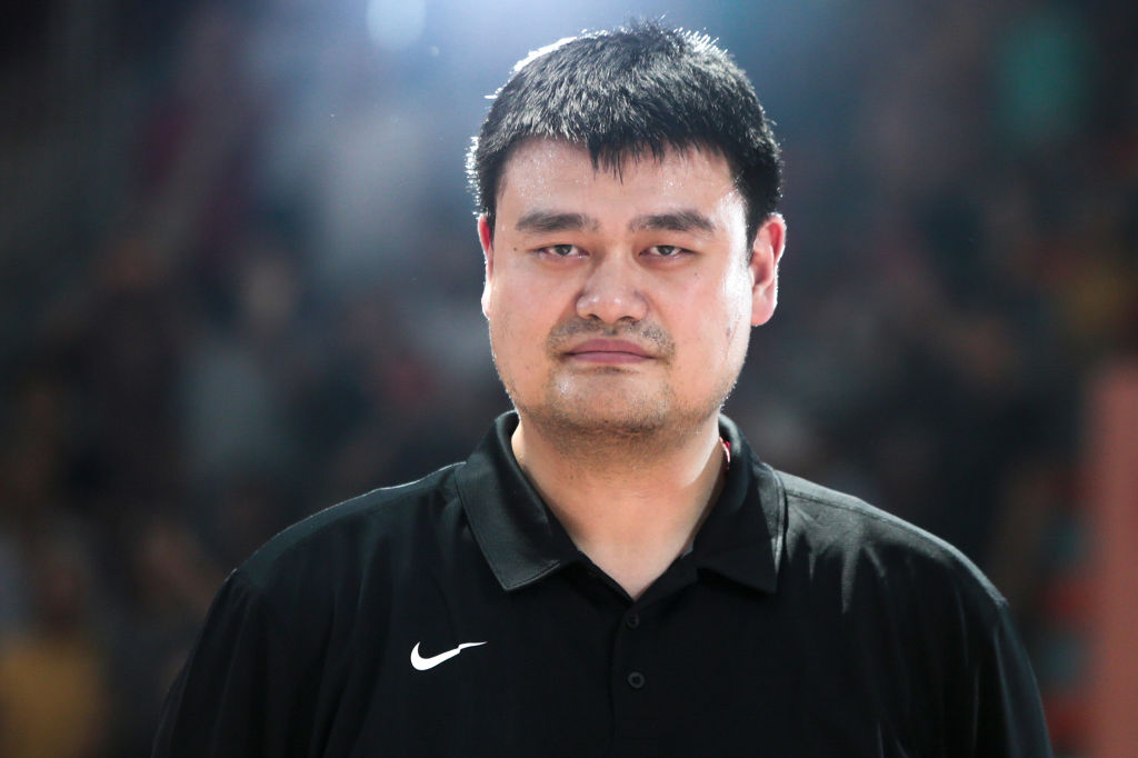 Chinese Basketball Association President Yao Ming, also the founder of Yao Foundation, looks on during an exhibition game