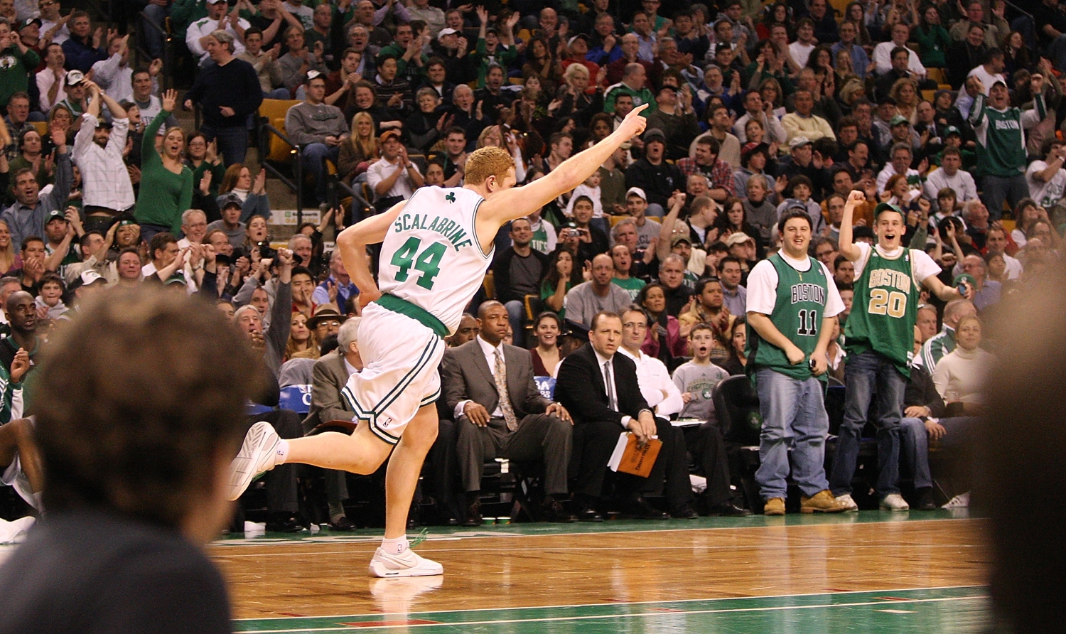 Brian Scalabrine celebrates as he runs down the court as a member of the Boston Celtics.