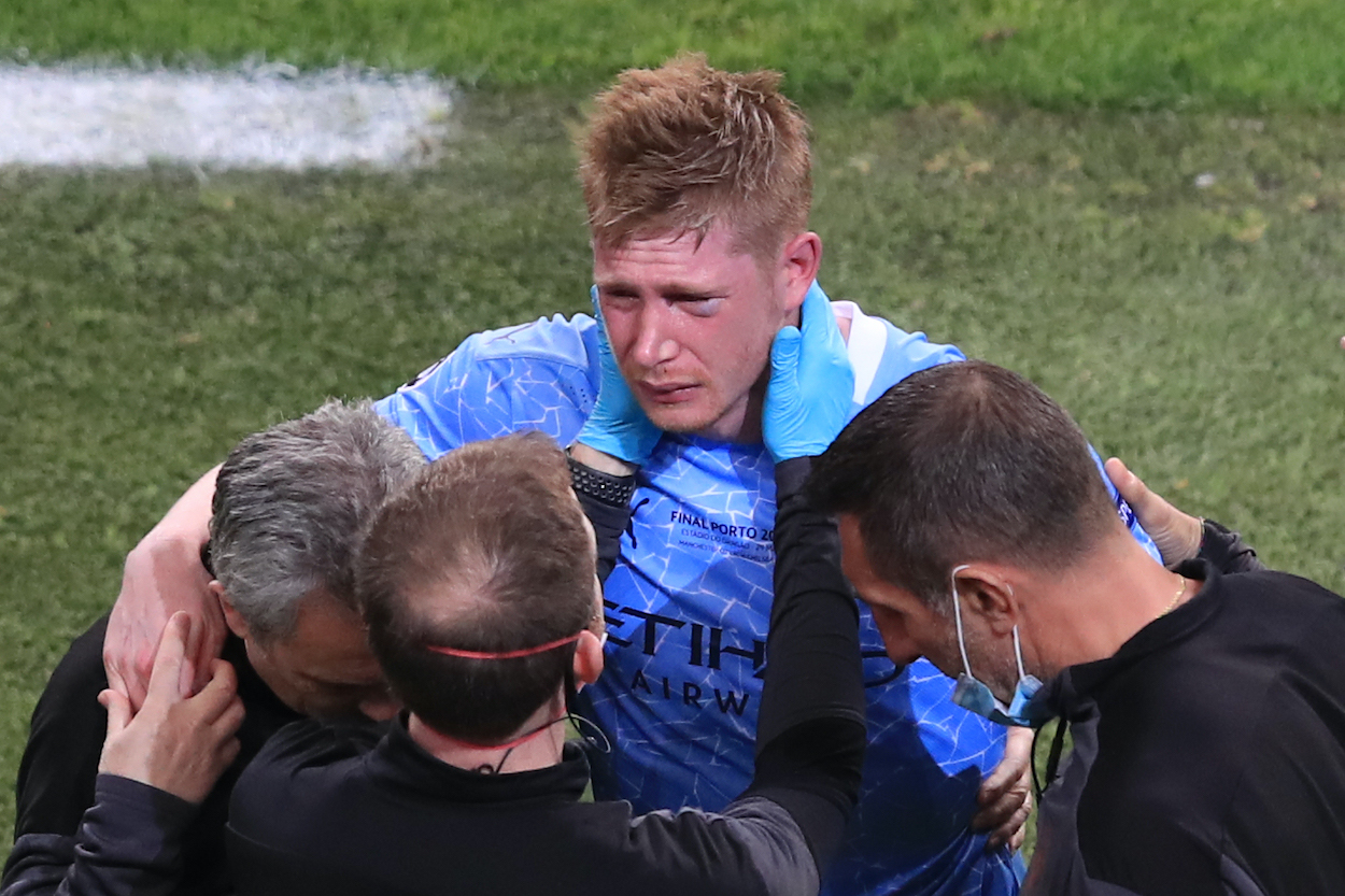 Kevin De Bruyne of Manchester City looks dejected after being forced off with a head injury after a collision with Antonio Rudiger of Chelsea. during the UEFA Champions League Final between Manchester City and Chelsea FC at Estadio do Dragao on May 29, 2021 in Porto, Portugal.