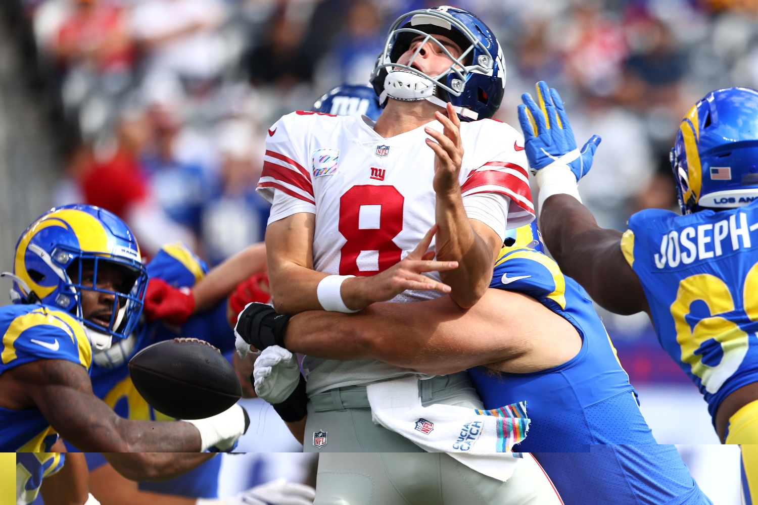 New York Giants QB Daniel Jones gets strip-sacked during a game against the Los Angeles Rams.