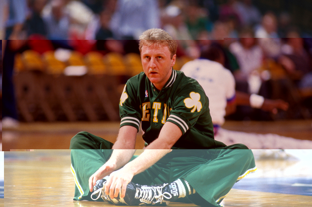 Boston Celtics star Larry Bird stretches before a game.