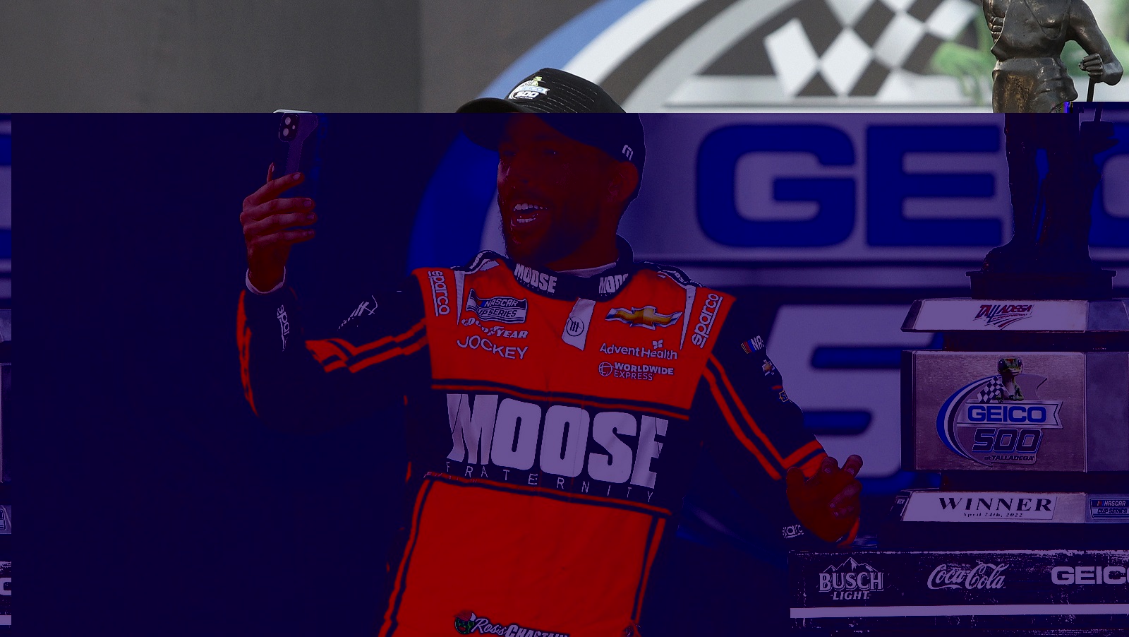 Ross Chastain, driver of the No. 1 Chevrolet, takes a selfie on Victory Lane after winning the NASCAR Cup Series GEICO 500 at Talladega Superspeedway on April 24, 2022.
