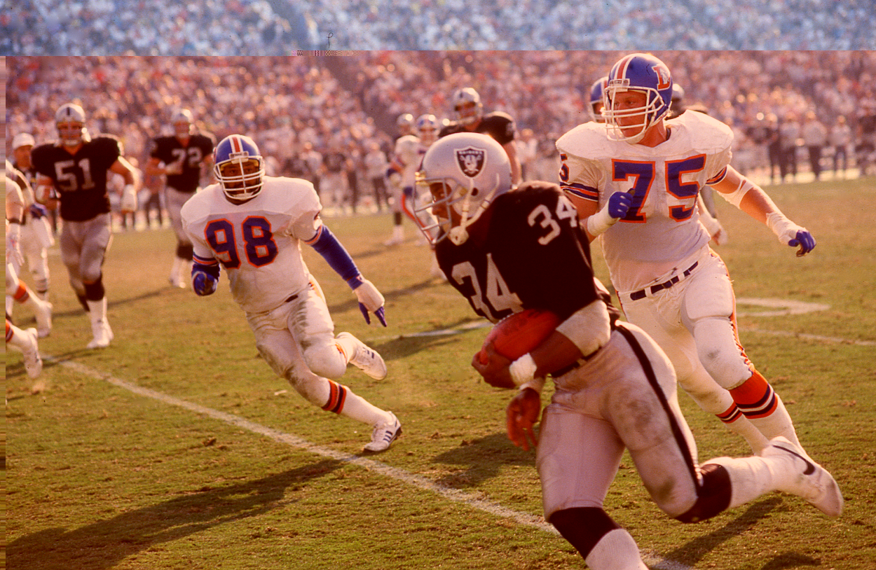 Bo Jackson of the Los Angeles Raiders rushes against the Denver Broncos.