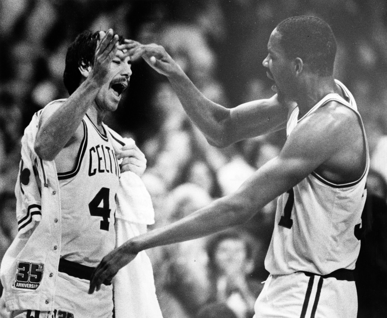 Boston Celtics player Chris Ford, left, greets Cedric Maxwell.