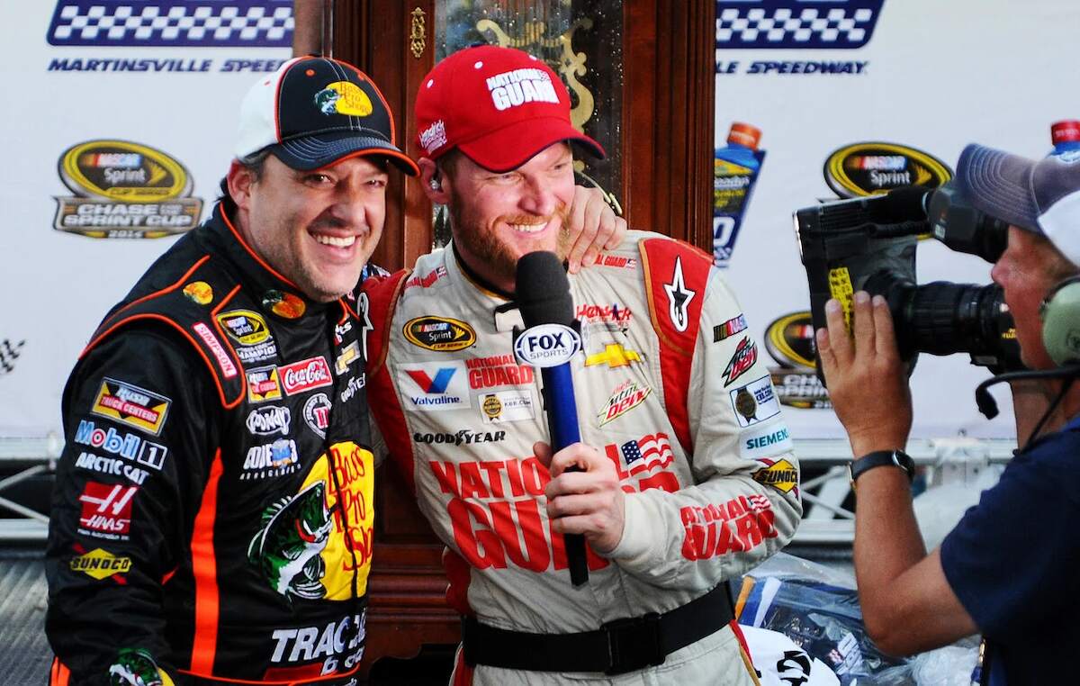 Dale Earnhardt Jr. and Tony Stewart laugh together in 2014
