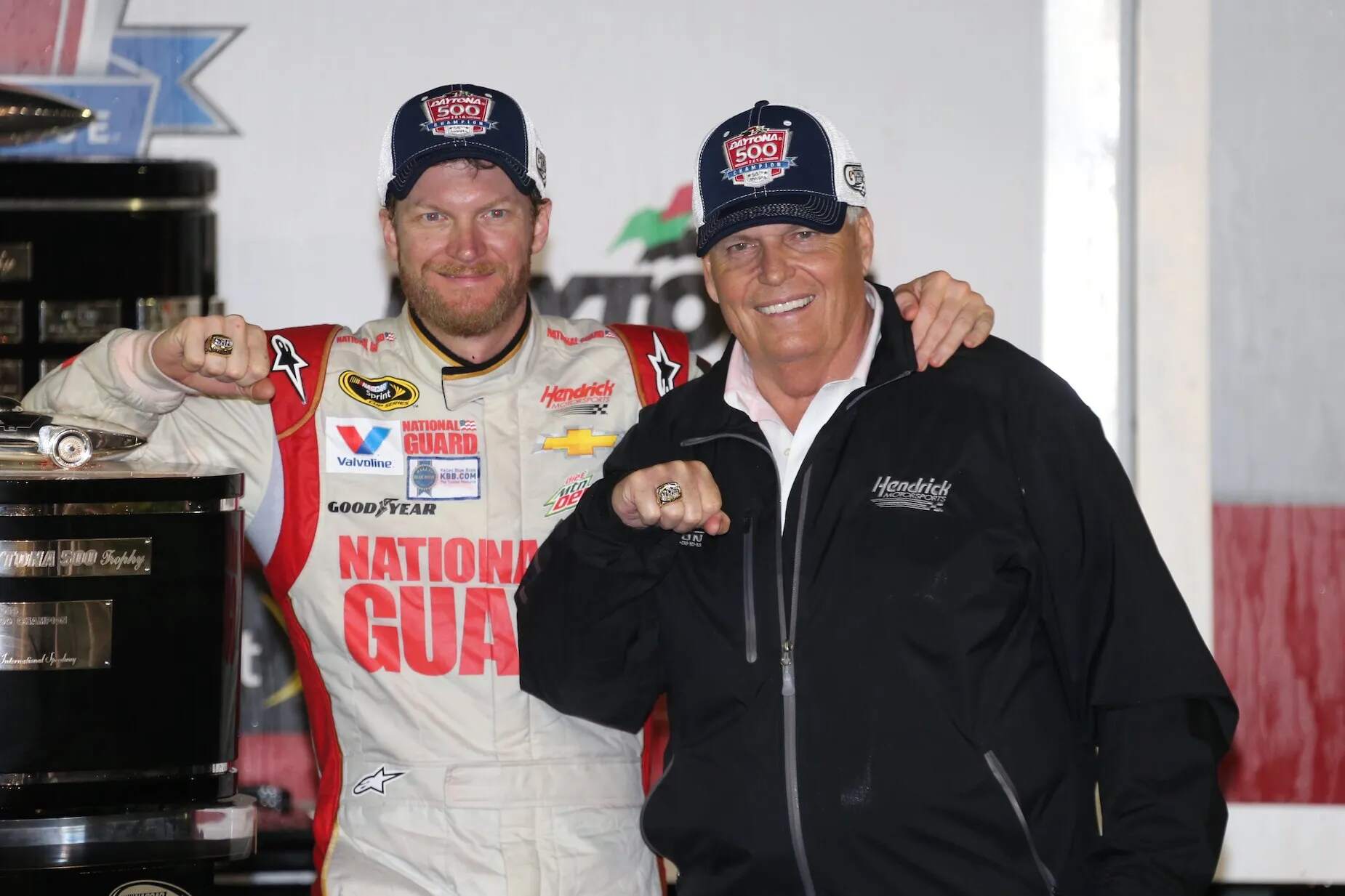 NASCAR driver Dale Earnhardt Jr. and owner Rick Hendrick show off their Daytona 500 rings in 2014