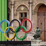 Paris, FRANCE; the Olympic rings are on display outside of the Hotel de Ville a