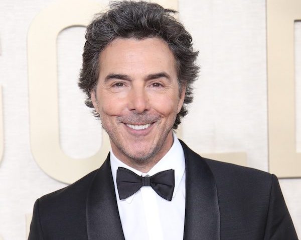 Shawn Levy poses for a photo on the red carpet.